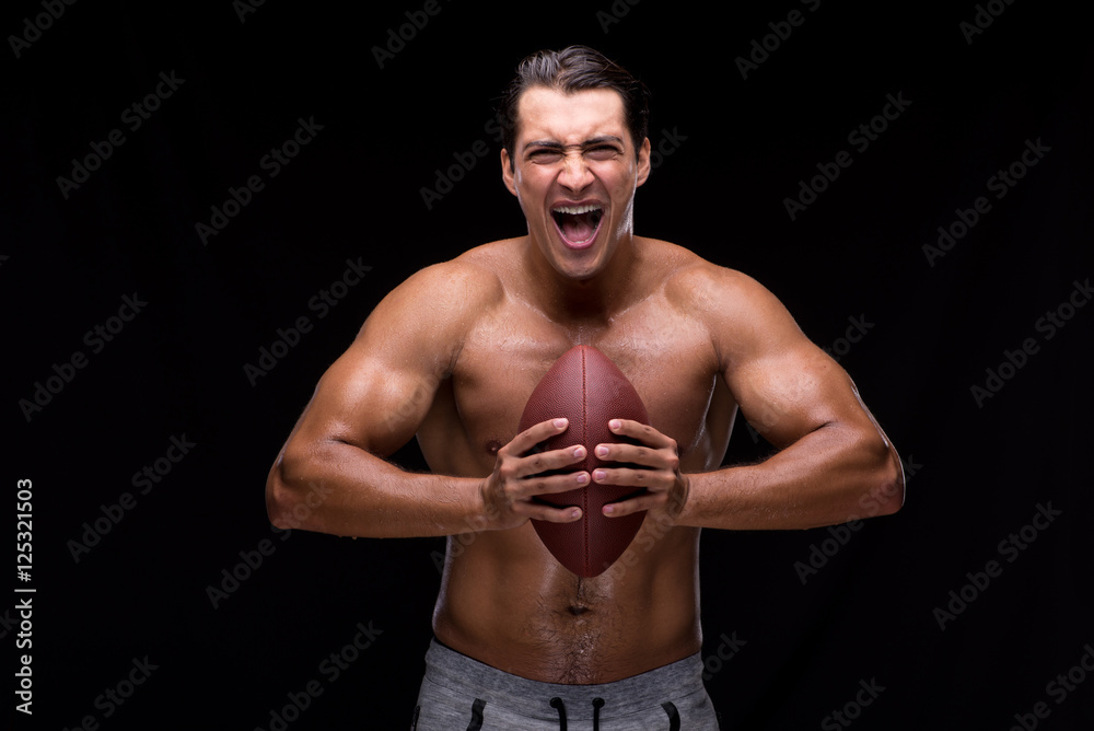 Ripped muscular man with american football Ripped muscular man with american football