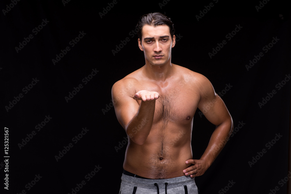 Ripped muscular man pressing virtual buttons Ripped muscular man pressing virtual buttons