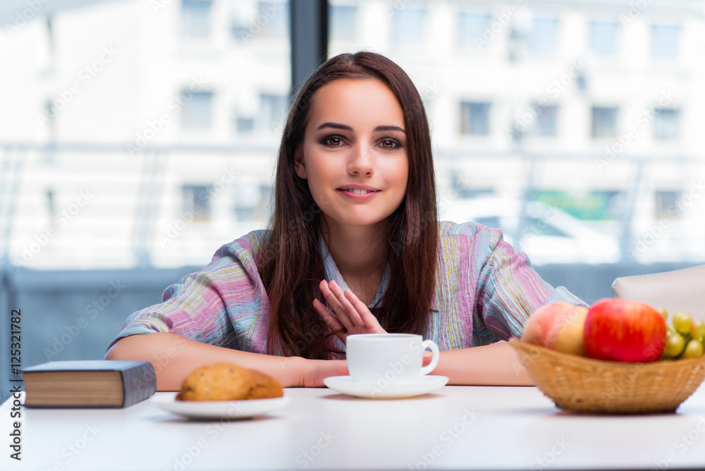 Young girl having breakfast on the morning