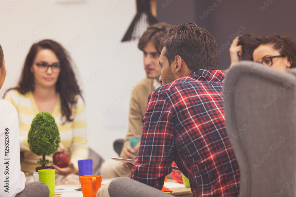 Group of young business professionals having a meeting. Group of young business professionals having a meeting.