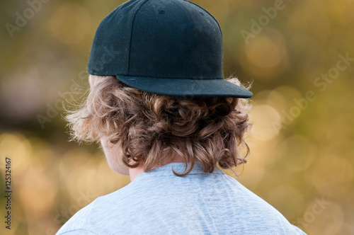 Teen with backwards hat