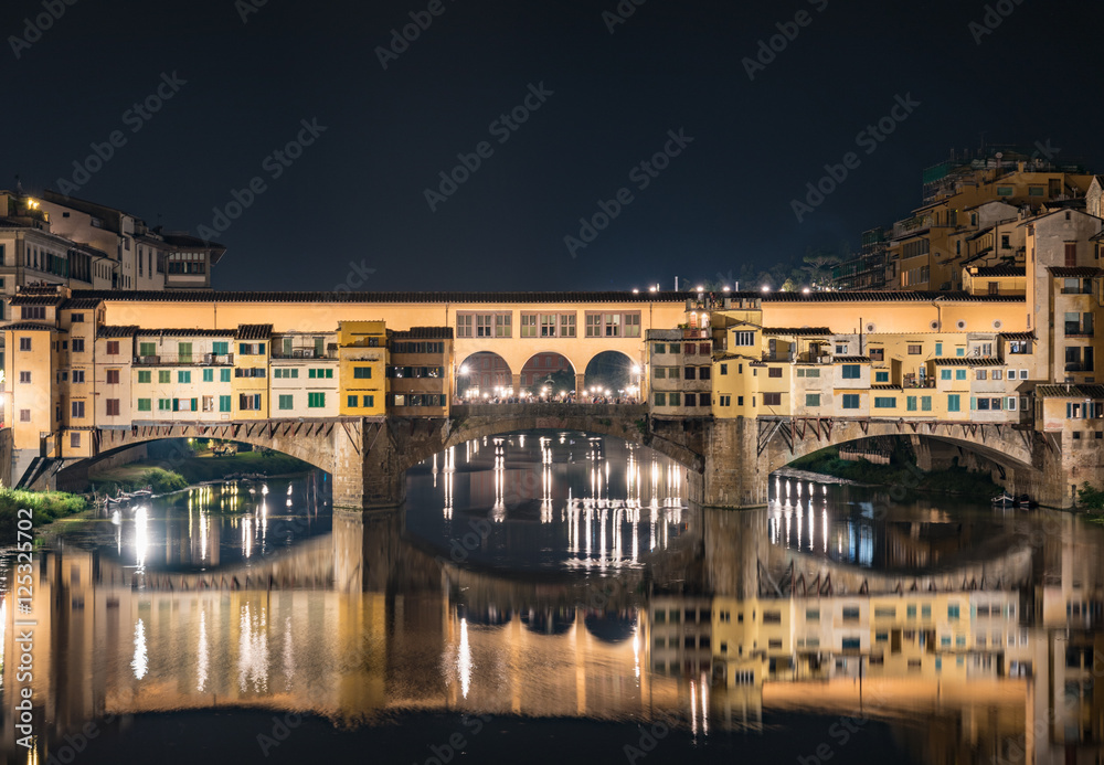 Night view of the historic bridge of Ponte Vecchio in Florence