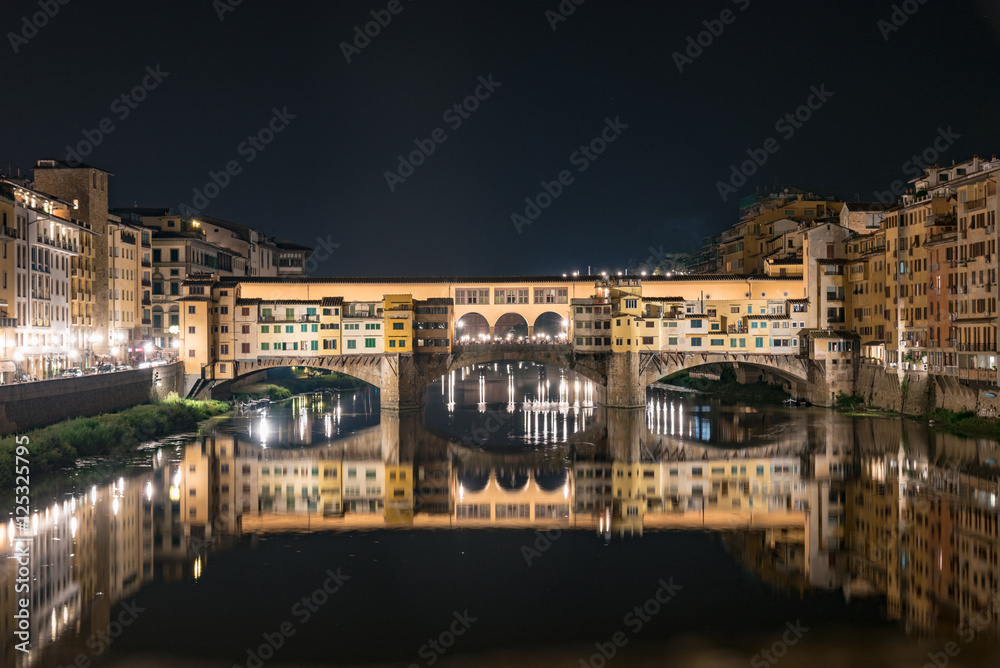 Night view of the historic bridge of Ponte Vecchio in Florence