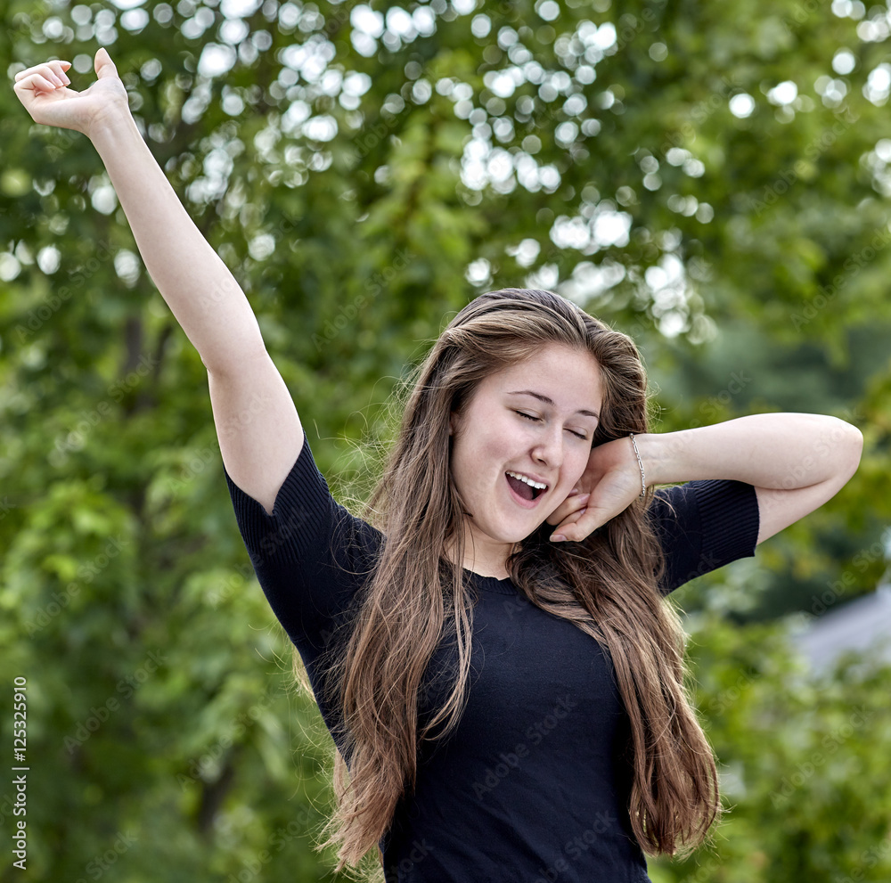 Young Woman Yawning and Stretching