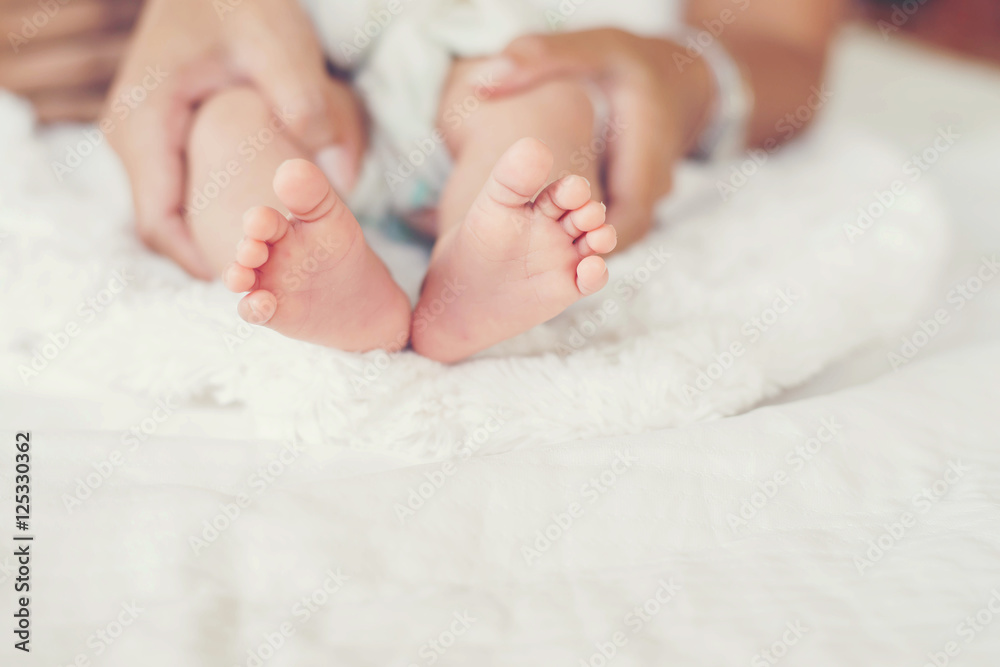 Newbron Baby feet in the mother hands. Newbron Baby feet in the mother hands.