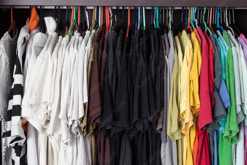 Colorful of T-Shirt hanging in wardobe