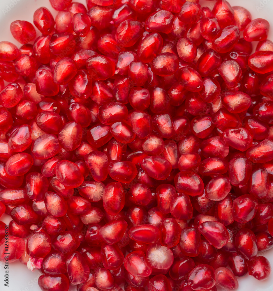 Fresh ripe pomegranate. Macro with shallow depth of field. Fresh ripe pomegranate. Macro with shallow depth of field.