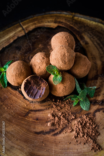 Fototapeta Naklejka Na Ścianę i Meble -  Chocolate mint truffles, homemade chocolate truffle. Vertical, selective focus. Shamrock