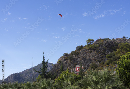 Tourist playing paragliding
