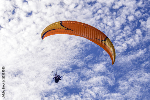 Tourist playing paragliding