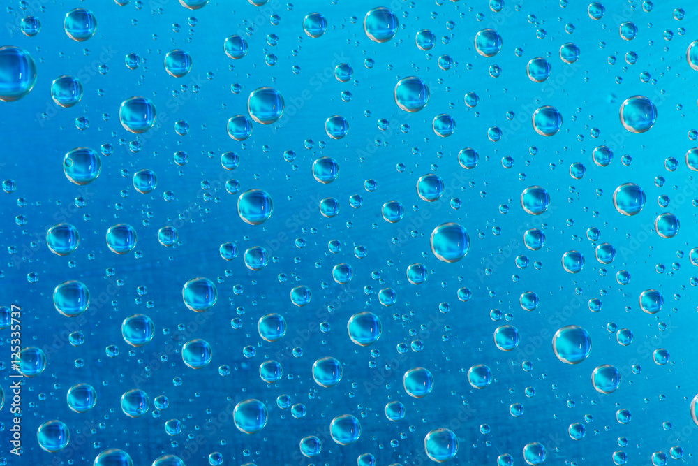 drop of water on blue background