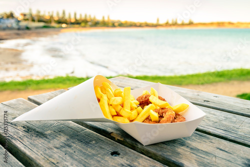 Calamari rings with chips on the table photo