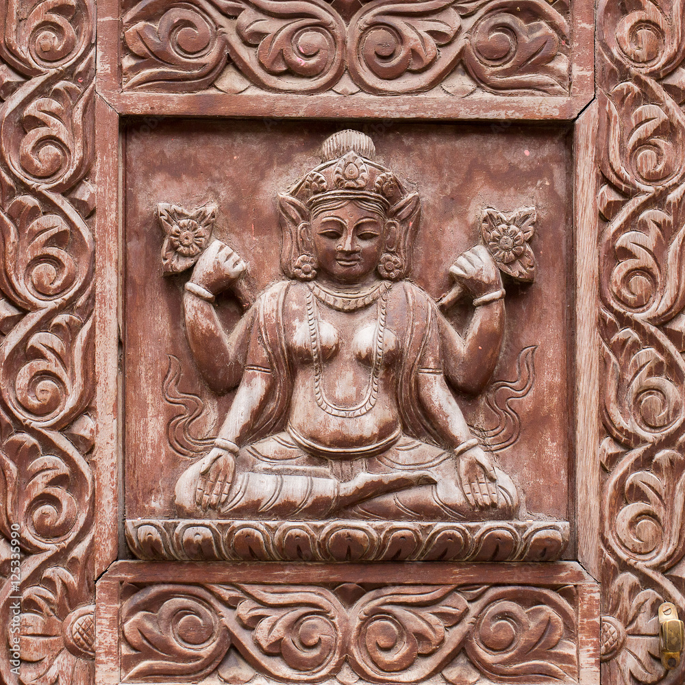 Detail wooden carved door in hindu temple, Kathmandu, Nepal background. Close up