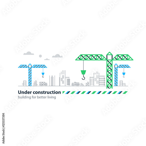 Real estate building company, under construction sight banner, cranes