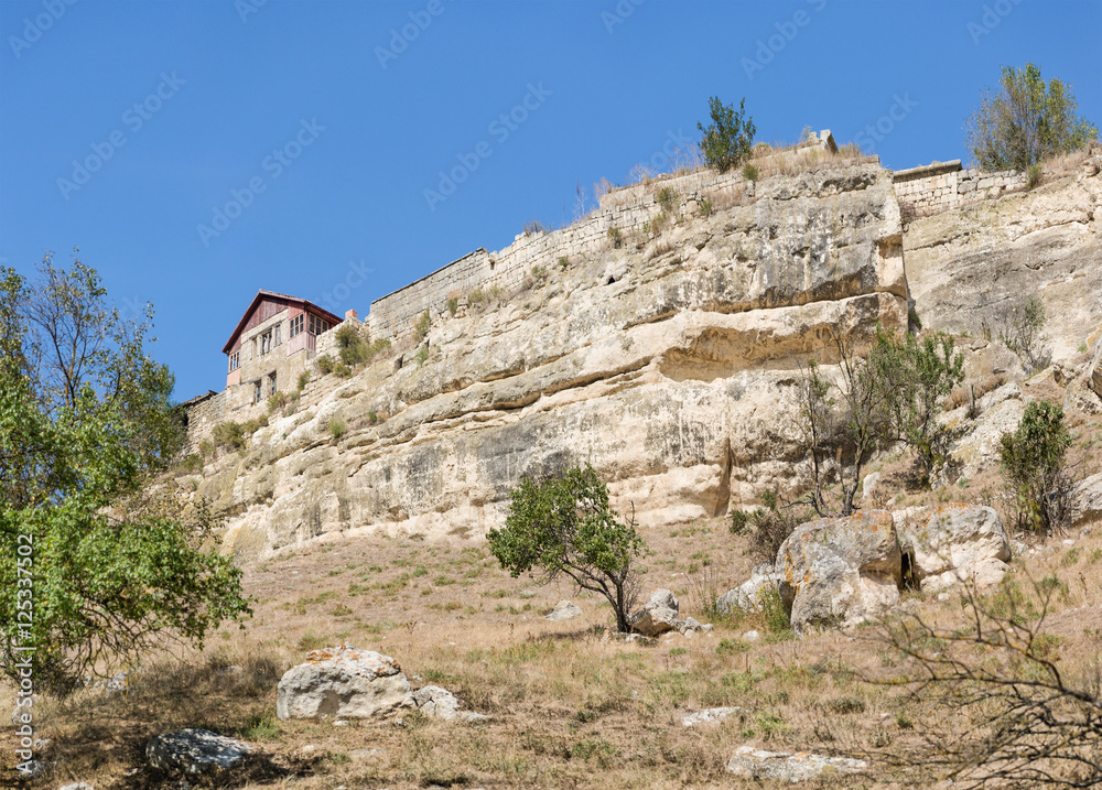 South of the rock and the House of the Karaite writer and archaeologist Abraham Firkovich in the medieval town-fortress Chufut-Kale . Bakhchysaray, Crimea