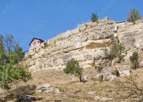 South of the rock and the House of the Karaite writer and archaeologist Abraham Firkovich in the medieval town-fortress Chufut-Kale . Bakhchysaray, Crimea photo