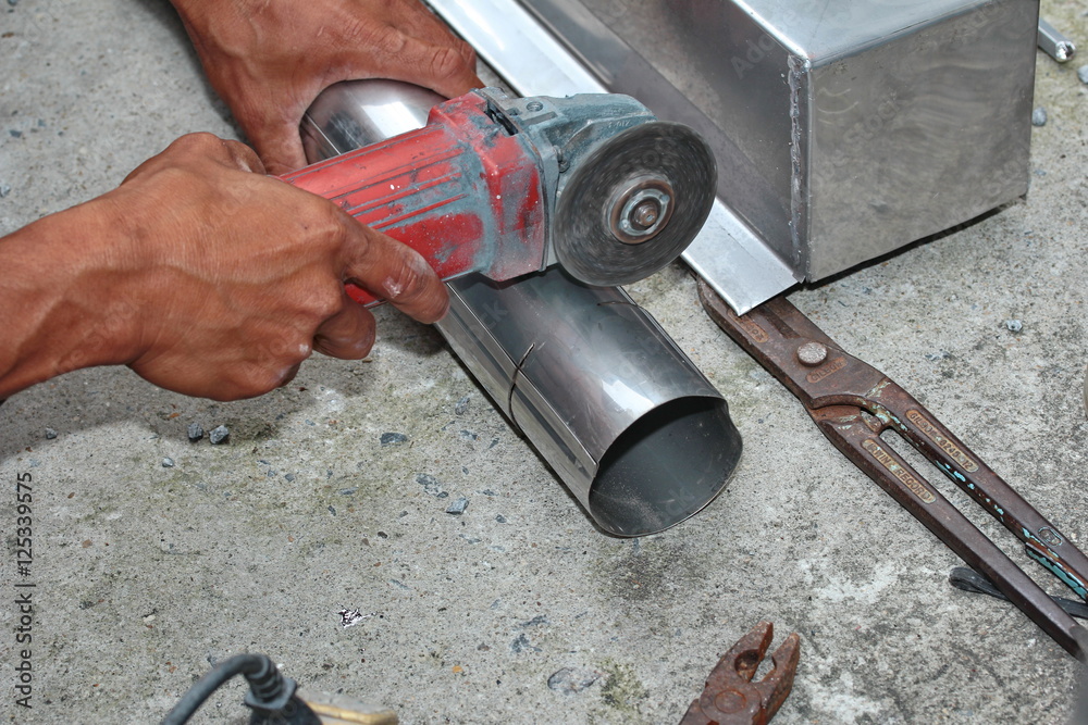 Aluminium gutter welding by using soldering copper with picnic gasTechnician cut aluminium pipe