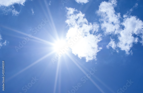 Beautiful blue sky sunbeams and clouds with sun rays nature back