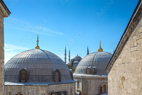 View of the Blue Mosque over the Ottoman Imperial Tombs from a window of the Hagia Sophia museum in Istanbul, Turkey.
 photo