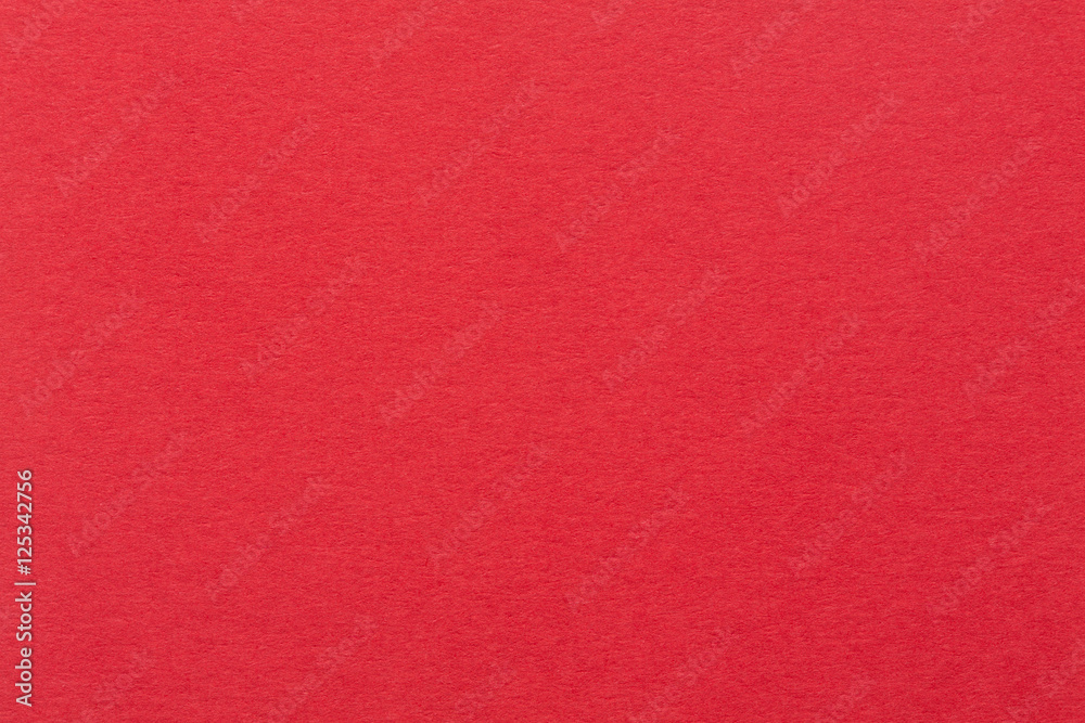 A red paper background with mottled texture. A red paper background with mottled texture.