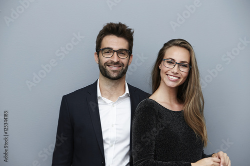 Happy couple smiling at camera, portrait photo