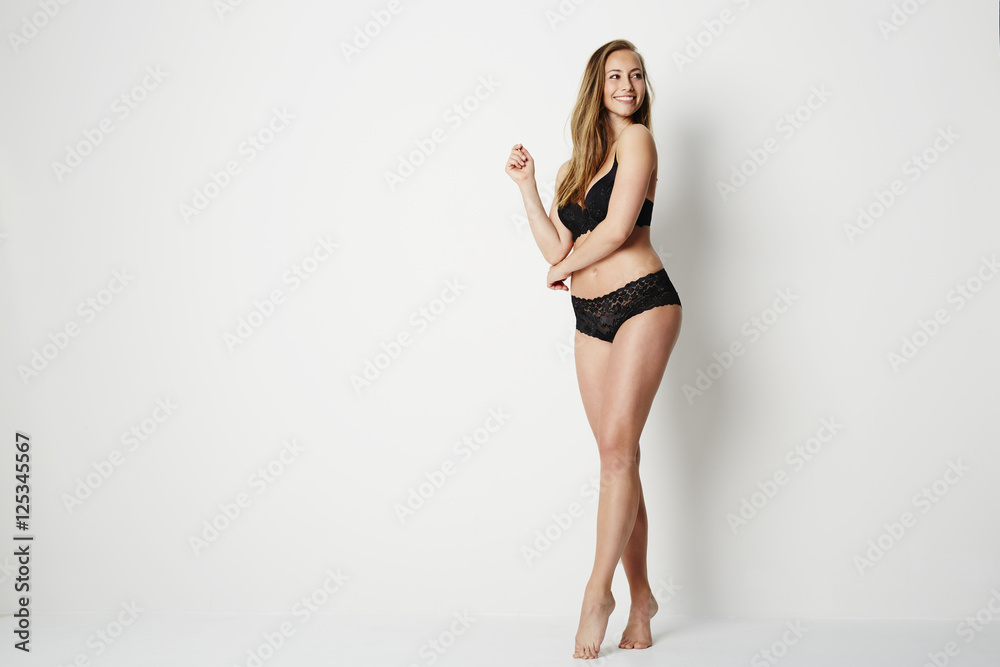 Beautiful woman in black lingerie, studio