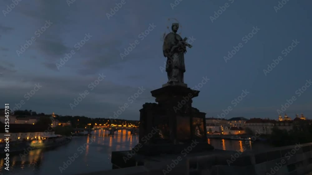 Steadicam shot of walking on Charles Bridge at night, view to the river and illuminated waterfront city. Visiting Prague, Czech Republic Steadicam shot of walking on Charles Bridge at night, view to the river and illuminated waterfront city. Visiting Prague, Czech Republic