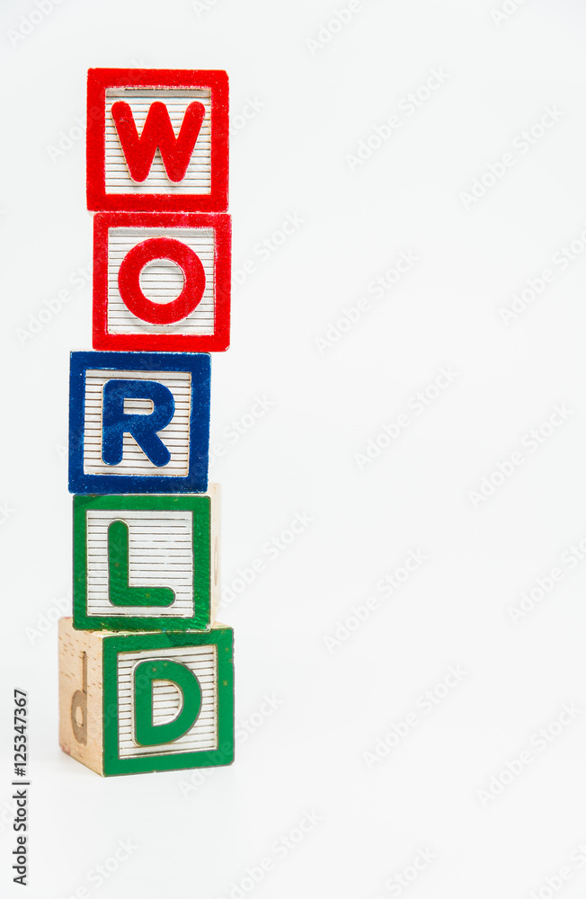 WORLD word wooden block arrange in vertical style on white background and selective focus WORLD word wooden block arrange in vertical style on white background and selective focus