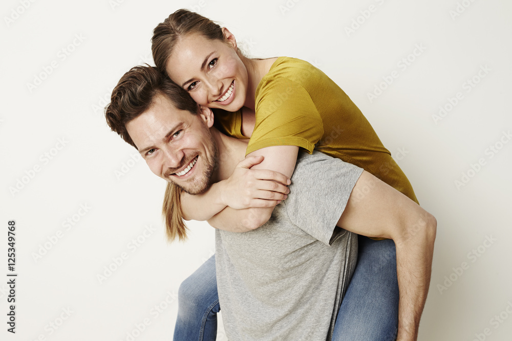 Fun couple smiling at camera, portrait