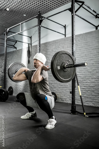 Man's crossfit workout with barbell