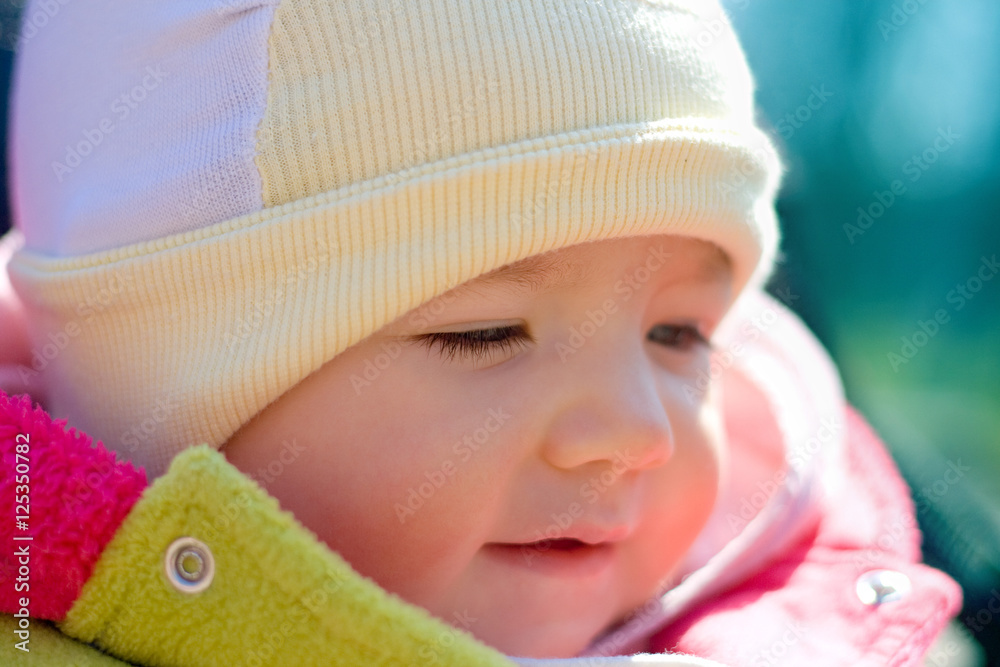 Lovely face of the infant in the sunny day Lovely face of the infant in the sunny day