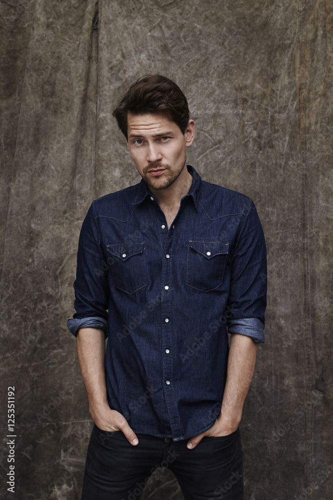 Portrait of denim shirt guy, studio Portrait of denim shirt guy, studio