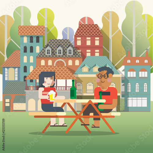 Men and women drink in the garden on holiday