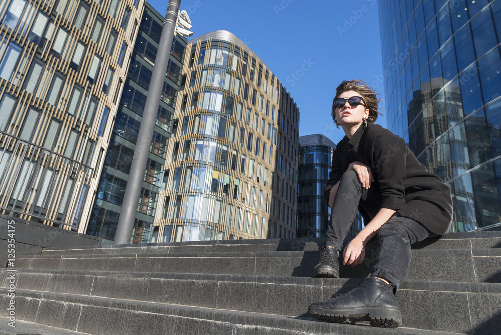 Beautiful girl on the background of a skyscraper in St. Petersbu Beautiful girl on the background of a skyscraper in St. Petersbu