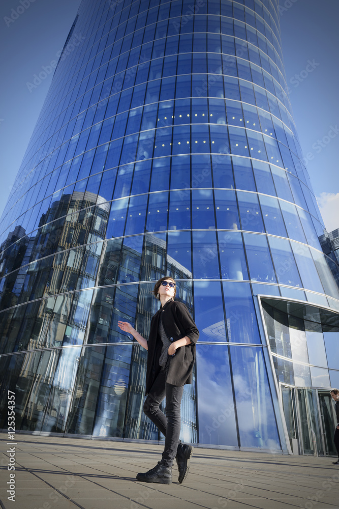 Beautiful girl on the background of a skyscraper in St. Petersbu Beautiful girl on the background of a skyscraper in St. Petersbu