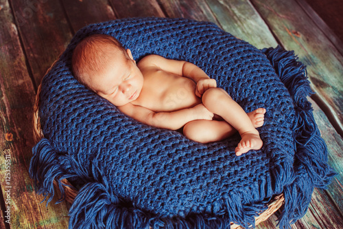 Incredible newborn baby sleeps in a basket