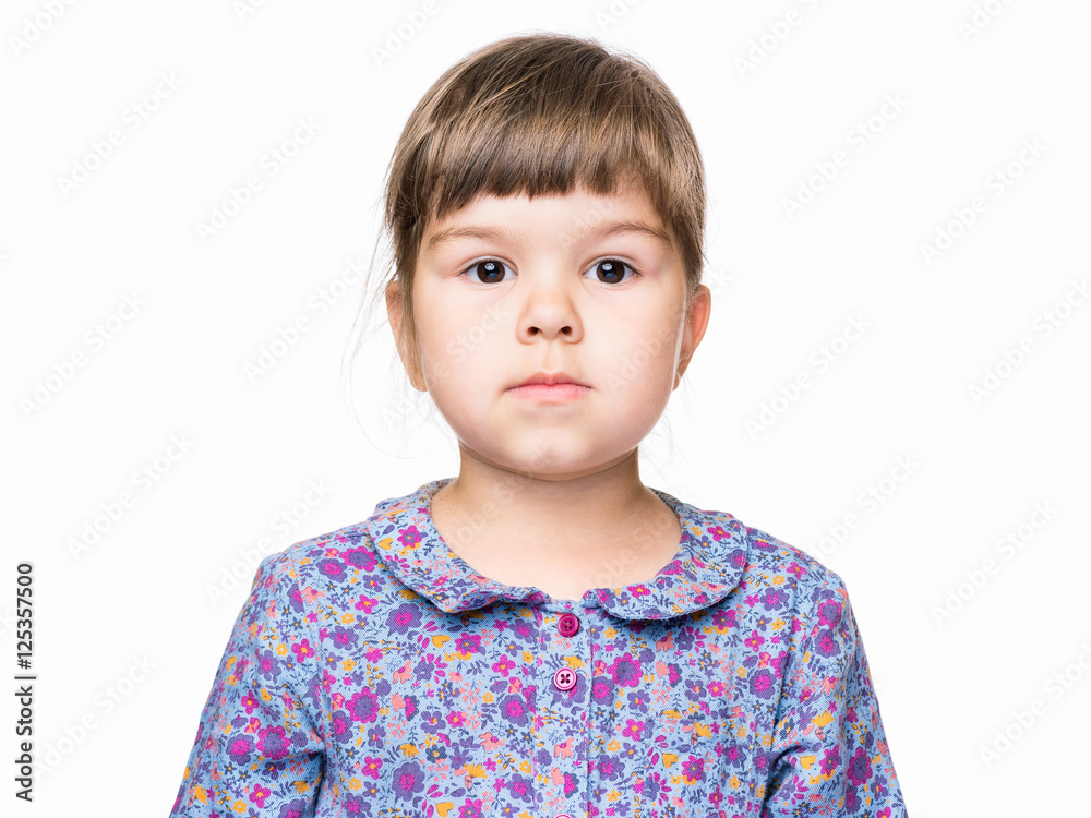 Emotional portrait of a 3 years old girl, serious. Cute caucasian baby isolated on white background. Beautiful preschool child posing in studio. Healthy carefree kid playing indoors. Emotional portrait of a 3 years old girl, serious. Cute caucasian baby isolated on white background. Beautiful preschool child posing in studio. Healthy carefree kid playing indoors.