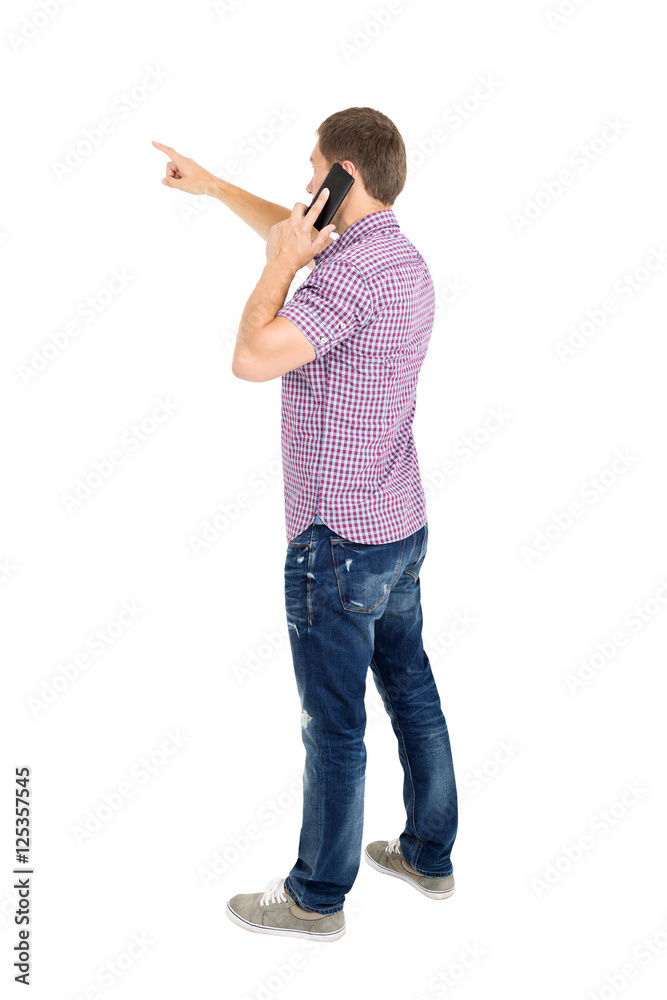 Back view of pointing young men talking on phone Back view of pointing young men talking on phone