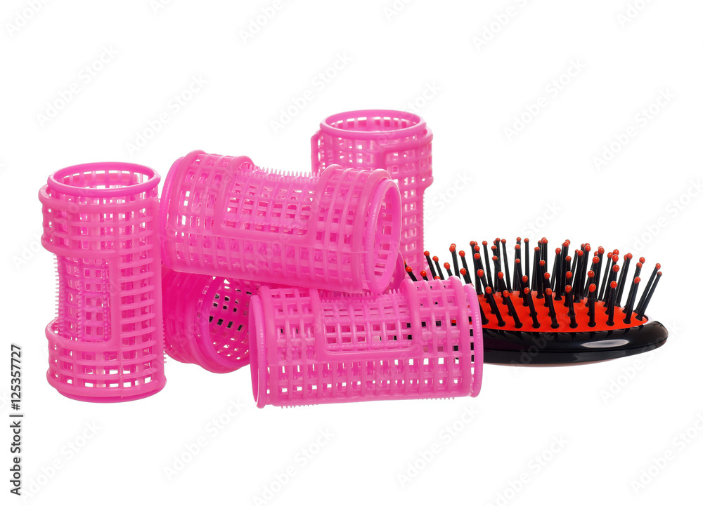 Plastic hairbrush with hair curlers, isolated on white background