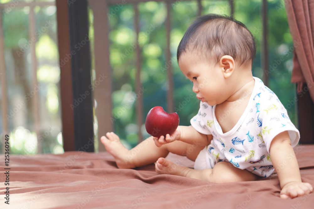 Fototapeta premium Asian baby and apple