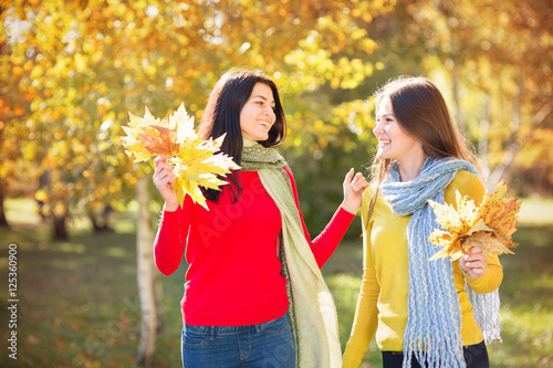 Two women in autumn park