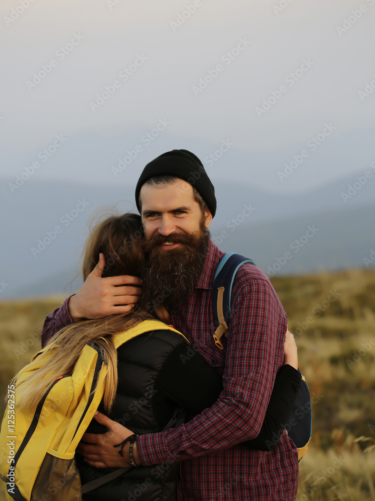 embracing couple on mountain top