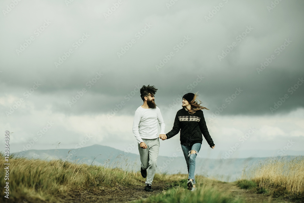 Couple walking on field road