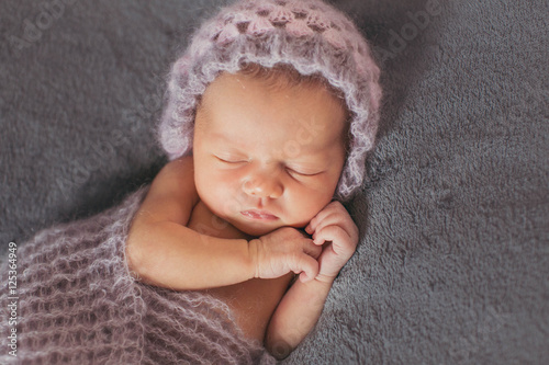 wonderful  newborn girl sleeping alone