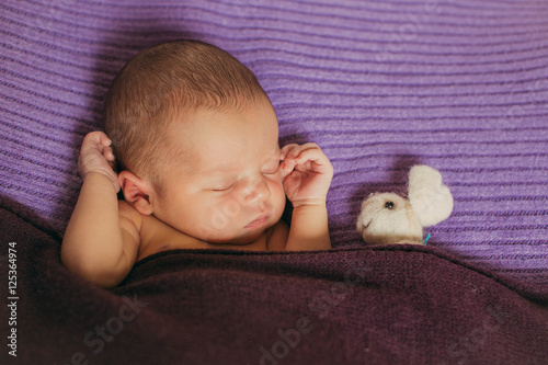 wondeful  newborn girl  sleeping in  the bed photo