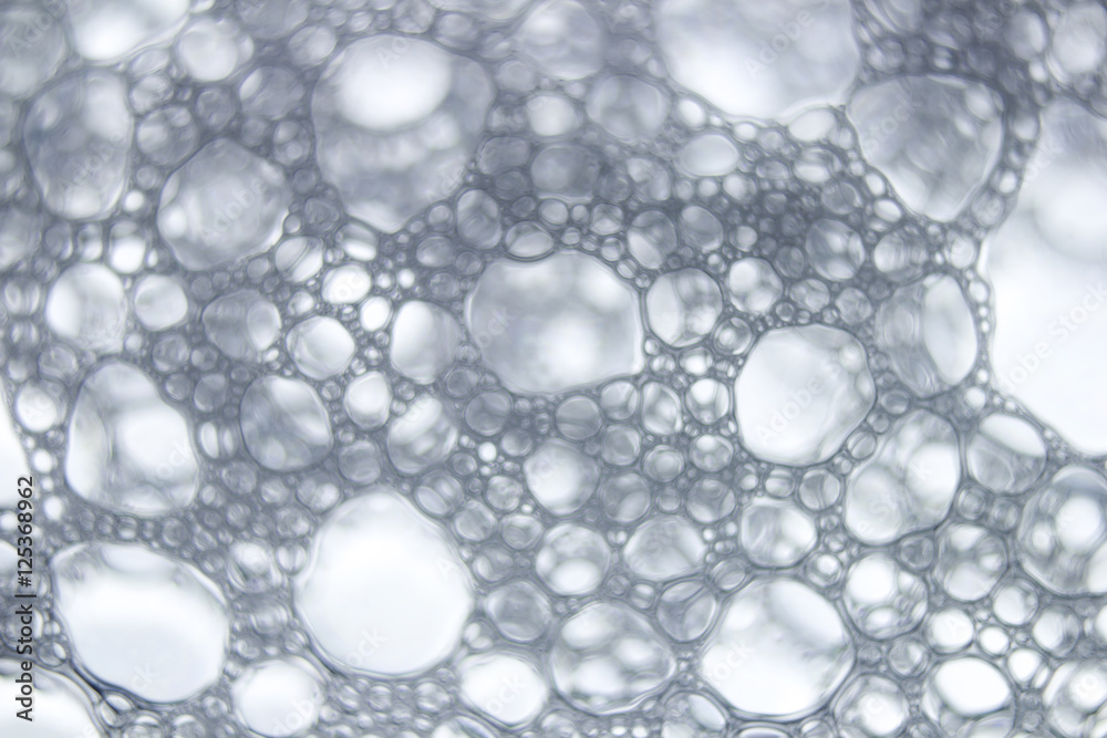Soapsuds background with air bubbles abstract texture. Blur