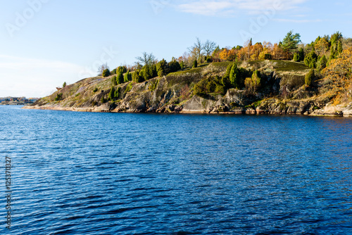 Granite cliff in coastal landscape in fall. Jarnavik in southern Sweden.