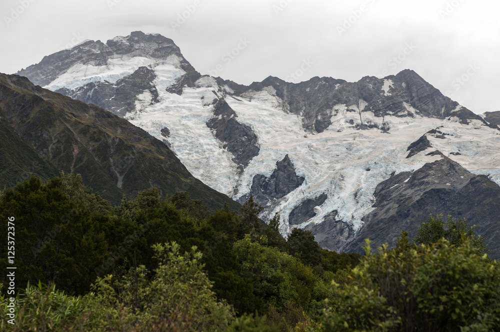 Mountain peaks covered by ice seen from Mount Cook Village, Aoraki / Mount Cook National Park, New Zealand