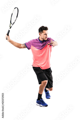 Young man playing tennis © takoburito