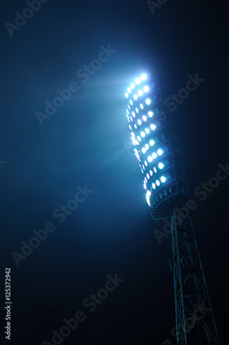 Stadium Lights against Dark Night Sky Background